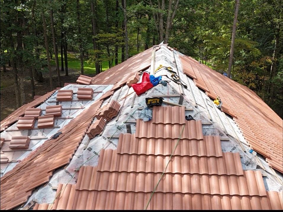 Clay tile roof installation in progress
