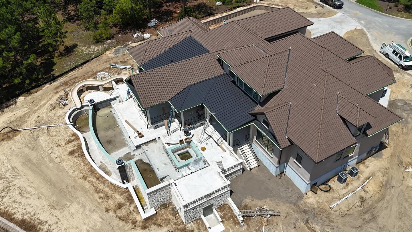 Luxury home roof replacement aerial view